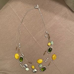 Multi-strand necklace.  Silver with green, golden yellow stones. NY Collection